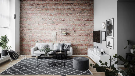 Кирпичная стена – изюминка современной гостиной
